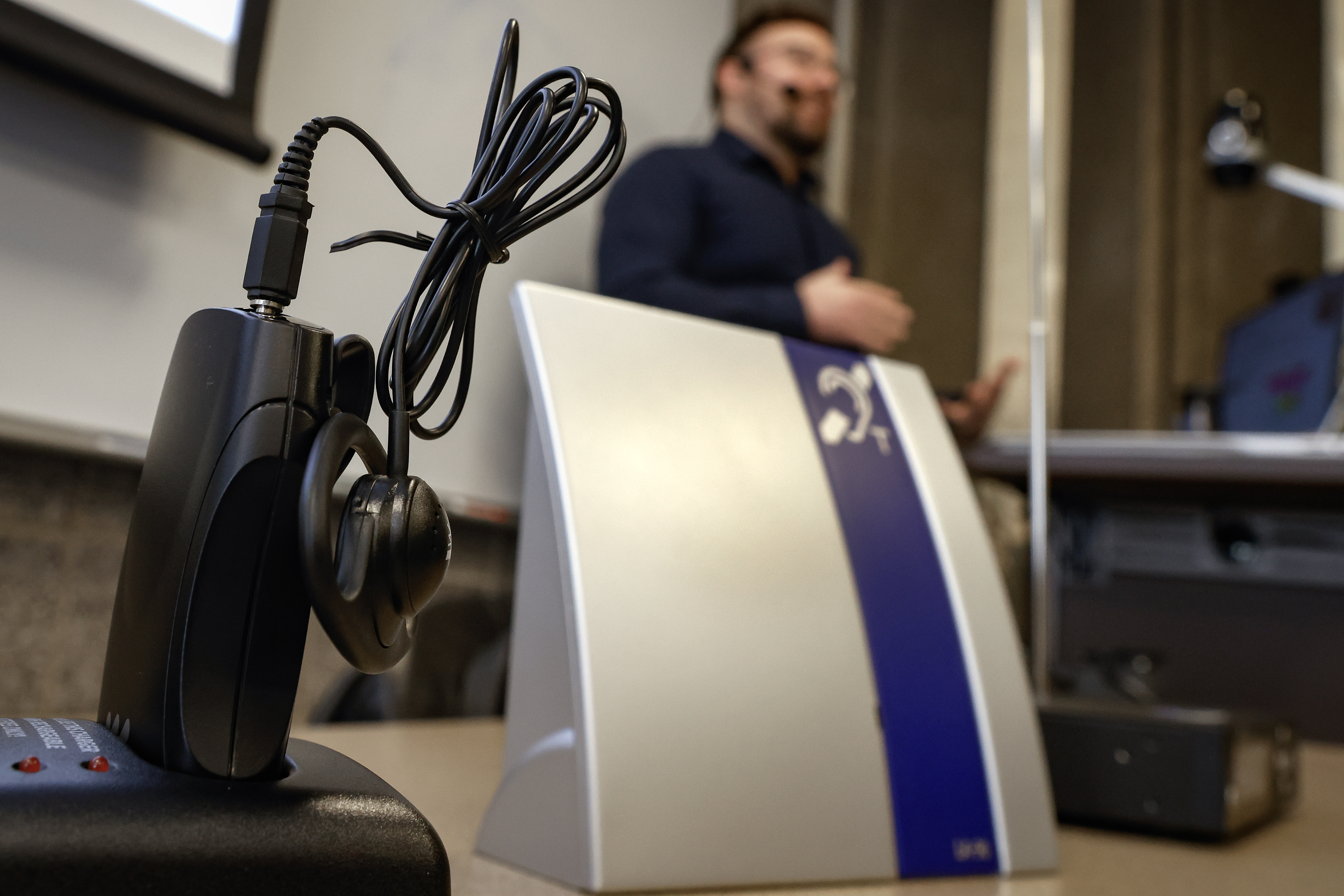 Corey demonstrates a wireless assistive listening system.
