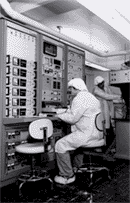 Semiconductor research int he 1980's. Graduate students W. Kopp and T.J. Drummand prepare a semiconductor thin film by molecular beam epitaxy. 