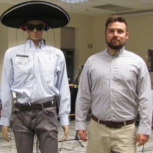 Corey with the mannequin the lab uses to demonstrate microphone usage all over a person's body.