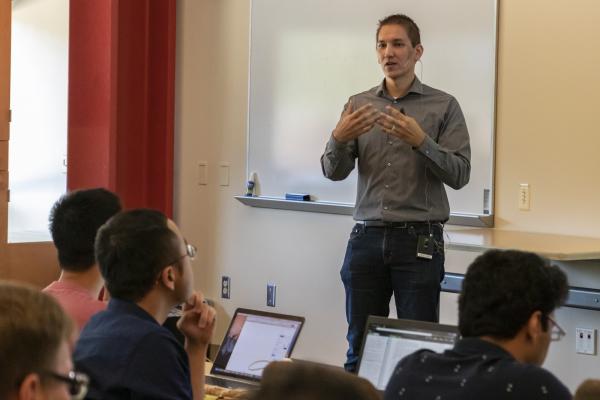 Kris Hauser speaking to students in the Siebel Center