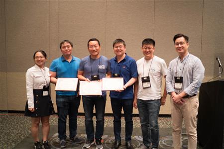 Three members of the team, Honghui Shi (second from left), Yunchao Wei (third from left) and Jinjun Xiong (third from right) accepted their certificates Monday in Salt Lake City.