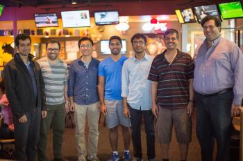 Sam Spencer, a CSL and ECE PhD student, was joined by members from his lab at the viewing party, including his advisor, CSL Professor R. Srikant (second from right).