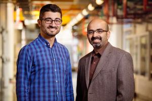 A robot under development at the University of Illinois automates the labor-intensive process of crop phenotyping, enabling scientists to scan crops and match genetic data with the highest-yielding plants. Agricultural and biological engineering and CSL professor Girish Chowdhary, right, is working on the $3.1 million project, along with postdoctoral researcher Erkan Kayacan.