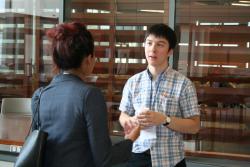 Conference attendee Harrison Kiang chats with session speaker Ranjitha Kumar. 