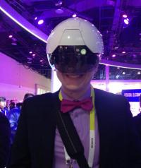 Graduate student Jeffrey Bigg tries out the Daqri Smart Helmet, a technology that could help utility and service workers in critical infrastructure. 