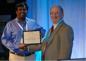 ECE PhD candidate Avinash Kumar (left) being presented the IAPR Piero Zamperoni Best Student Paper Award at the ICPR conference.