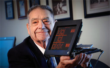 Donald Bitzer and a modern version of his plasma monitor.