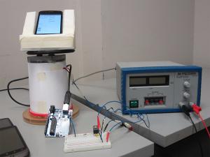 Experimental setup showing the external motor used for smartphone rotation.