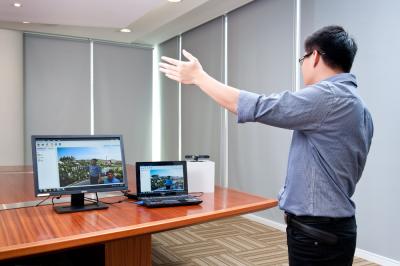 ADSC Research Scientist Jiangbo Lu demonstrates ADSC's tele-immersive meeting technology, which helped lead to the development of the PatchMatch Filter.
