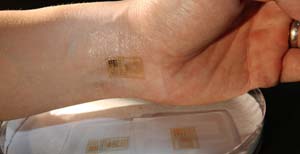 An ultra-thin, electronic patch with the mechanics of skin, applied to the wrist for EMG and other measurements. Photo: L. Brian Stauffer