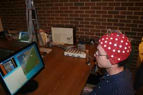 Students use EEG technology to control a flight simulator.